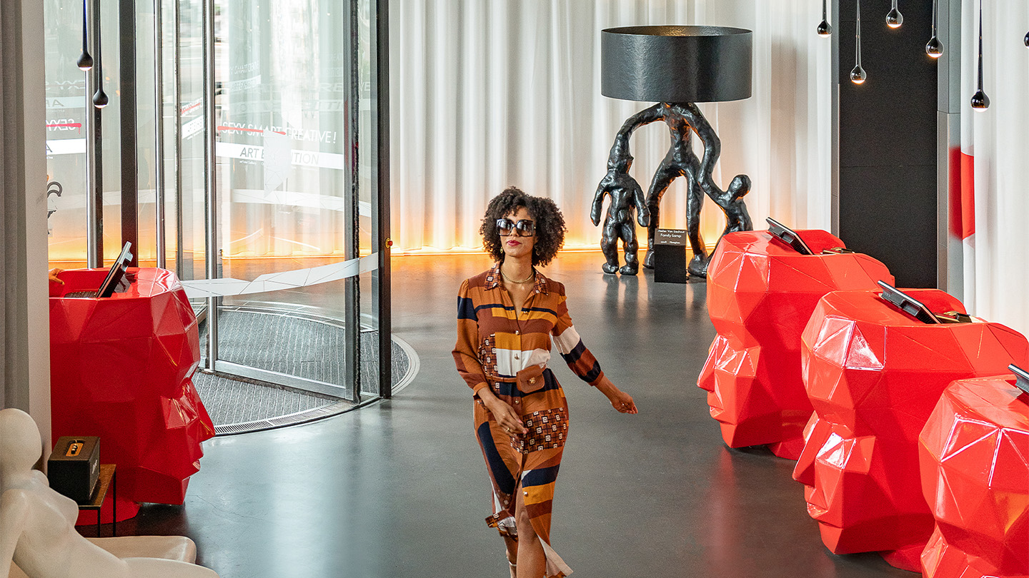 Woman walking through lobby of art'otel Amsterdam