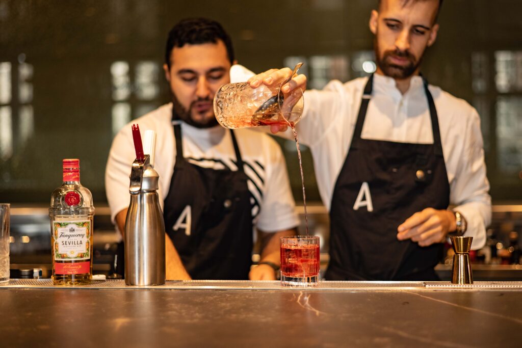 bartenders making cocktail at ARCA